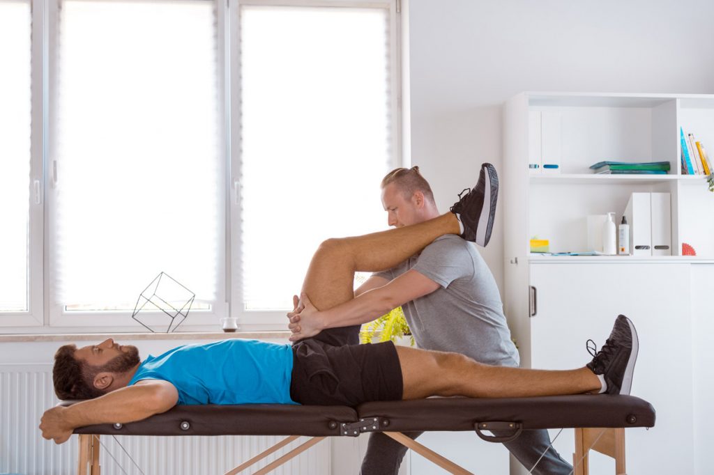 a physical therapist and a patient